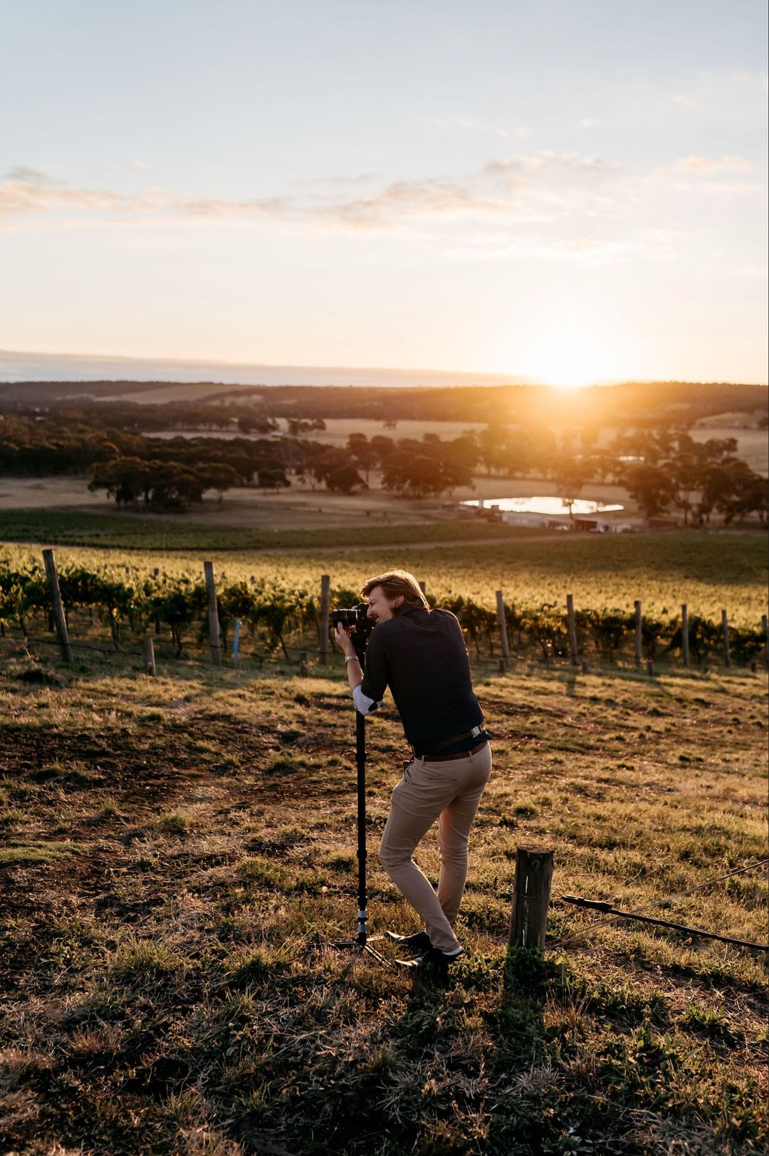 Jamie Ross filming on location at a vineyard wedding